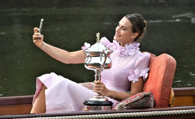 Belarusian professional tennis player Aryna Sabalenka poses for her own selfie with the Daphne Akhurst Memorial Cup after winning the 2023 Australian Open on January 29, 2023 in Melbourne, Australia. (Photo by James D. Morgan/Getty Images)