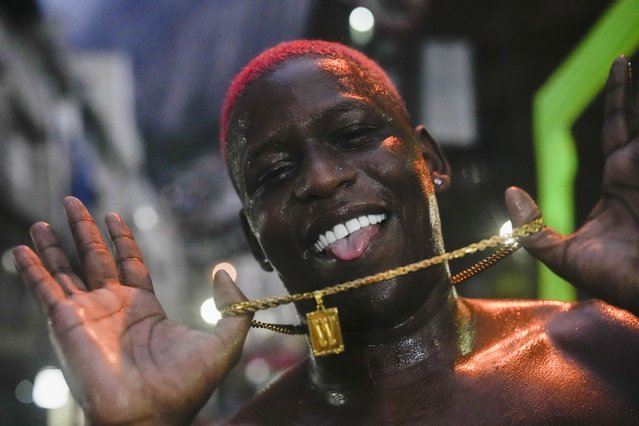 A youth strikes a pose after performing the street dance steps known as Passinho, recognized as a cultural heritage, in the Rocinha community of Rio de Janeiro, Brazil, Thursday, April 11, 2024.  (Photo by Silvia Izquierdo/AP Photo)