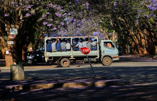 A truck carrying police officers on a street in Harare, Monday, October 19, 2020. The Zimbabwean government has urged people to continue observing Covid-19 regulations despite the fact that the country has been registering a steady decrease in daily positive cases. (Photo by Tsvangirayi Mukwazhi/AP Photo)