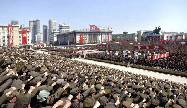 North Koreans including soldiers attend a rally in support of North Korean leader Kim Jong-un's order to put its missile units on standby in preparation for a possible war against the U.S. and South Korea, in Pyongyang March 29, 2013, in this picture released by the North's official KCNA news agency on Friday. North Korea put its rocket units on standby on Friday to attack U.S. military bases in South Korea and the Pacific, after the United States flew two nuclear-capable stealth bombers over the Korean peninsula in a rare show of force. (Photo by Reuters/KCNA)