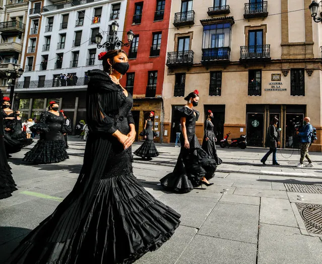 Several models walks during a protest on behalf of the flamenco fashion industry for not getting assistance from the government at Plaza Nueva square on October 28, 2020 in Sevilla, Spain. (Photo by Joaquin Corchero/AFP7/Getty Images)