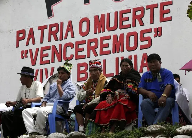 Indigenous leaders attend the end of the ceremony for the task of fighting against drugs in Chimore, east of La Paz, December 10, 2014. (Photo by David Mercado/Reuters)