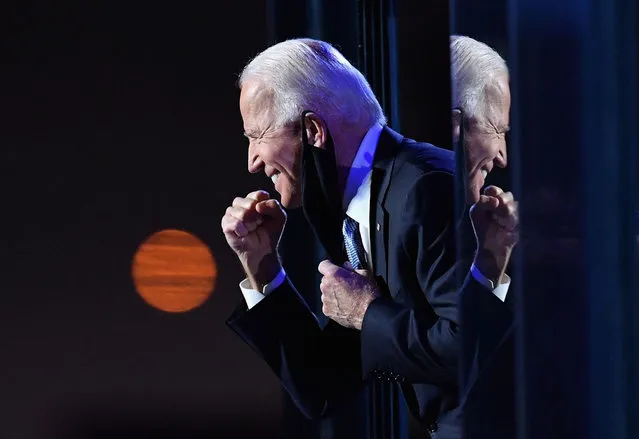 US President-elect Joe Biden gestures to the crowd after he delivered remarks in Wilmington, Delaware, on November 7, 2020. Democrat Joe Biden was declared winner of the US presidency November 7, defeating Donald Trump and ending an era that convulsed American politics, shocked the world and left the United States more divided than at any time in decades. (Photo by Angela Weiss/AFP Photo)