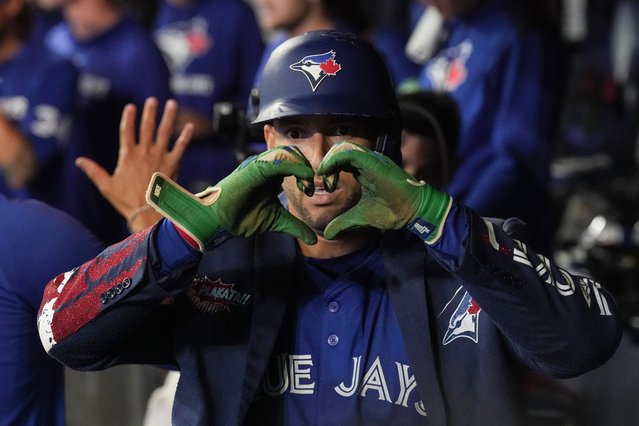 Toronto Blue Jays' George Springer Photo: 4) celebrates in the dug out after hitting a two-run home run off Boston Red Sox pitcher Zack Kelly during sixth inning MLB baseball action in Toronto on Thursday September 25, 2025. (Photo by Chris Young/The Canadian Press via AP Photo)