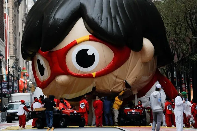 A balloon depicting Red Titan, a character from “Ryan's World”, is seen during the 94th Macy's Thanksgiving Day Parade closed to the spectators due to the spread of the coronavirus, in Manhattan, New York City, November 26, 2020. (Photo by Andrew Kelly/Reuters)