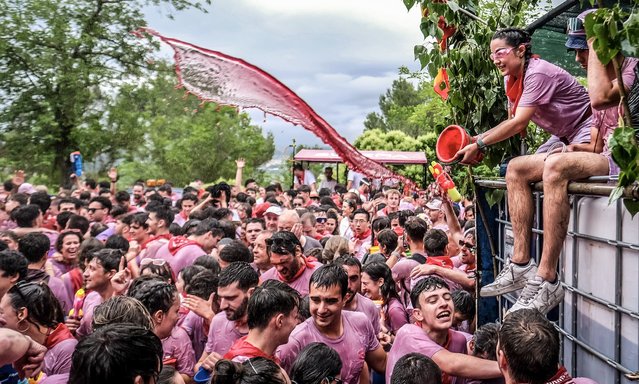 People attend the traditional “Battle of Wine” in the town of Haro, La Rioja province, northern Spain, 29 June 2024. More than eight thousand people took part in the Battle of Wine, celebrated annually on 29 June, where more than 40,000 liters of wine have been poured among participants equipped with all kinds of “weapons”, from water pistols to sprayers. (Photo by Fernando Diaz/EPA)