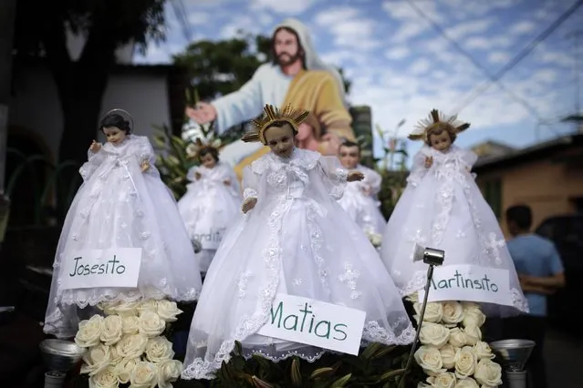 Figurines of baby Jesus are seen during a religious procession on Holy Innocents Day in Antiguo Cuscatlan, on the outskirts of San Salvador, December 28, 2014. (Photo by Jose Cabezas/Reuters)