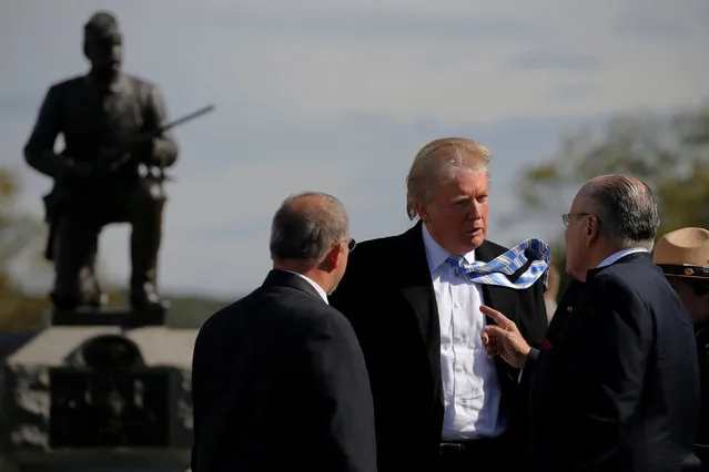 Republican U.S. presidential nominee Donald Trump speaks with former New York mayor Rudy Giuliani (R) as he visits Gettysburg National Military Park, site of an important battle in July 1863 during the U.S. Civil war, in Gettysburg, Pennsylvania, U.S. October 22, 2016. (Photo by Jonathan Ernst/Reuters)