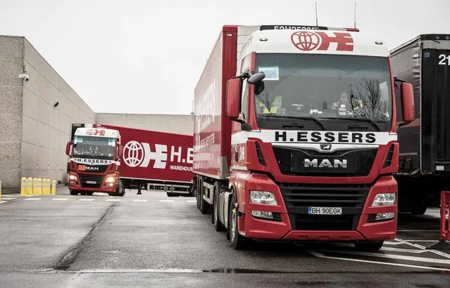 Trucks pull up to loading bays at Pfizer Manufacturing in Puurs, Belgium on Monday, December 21, 2020. The European Medicines Agency is meeting Monday to consider approving a coronavirus vaccine developed by BioNTech and Pfizer that would be the first to be authorized for use in the European Union. The closed-doors meeting comes weeks after the shot was granted permission under emergency provisions by regulators in Britain and the United States. (Photo by Valentin Bianchi/AP Photo)