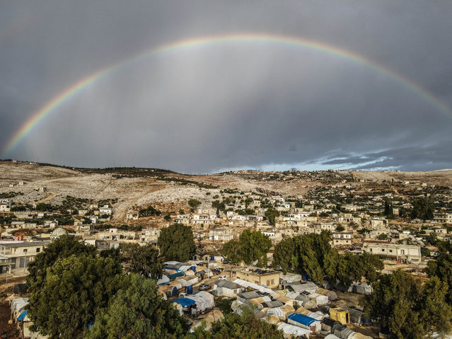 Rainbow appears in Idlib, Syria after the heavy rain on October 21, 2022. (Photo by Izzeddin Kasim/Anadolu Agency via Getty Images)