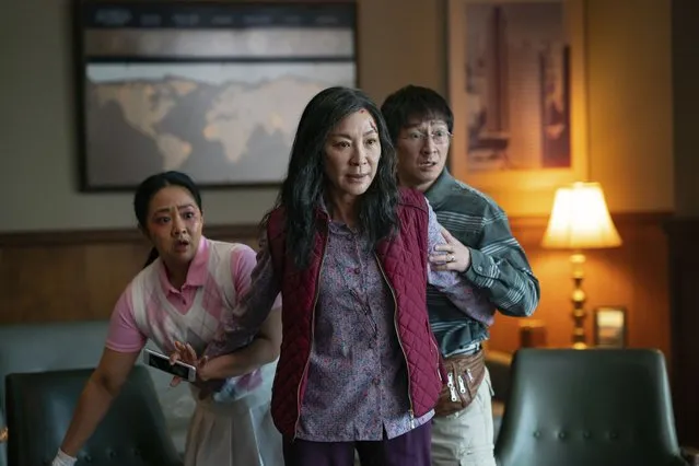 This image released by A24 Films shows, from left, Stephanie Hsu, Michelle Yeoh and Ke Huy Quan in a scene from “Everything Everywhere All At Once”. (Photo by Allyson Riggs/A24 Films via AP Photo)