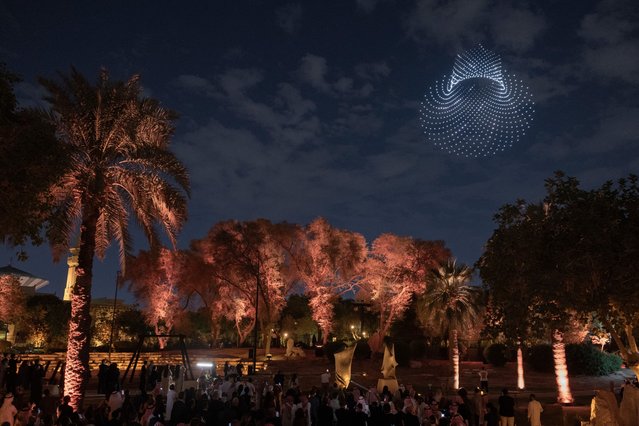 In this image released on Monday, Dec. 2, 2024, Aether (2024), a performative artwork composed of 1,500 drones, is exhibited on the preview day of Noor Riyadh 2024 on Tuesday, November 26, 2024 in Riyadh. The festival features more than 60 large-scale artworks that explore the relationship between the physical and the metaphysical. (Photo by Naif Alquba/AP Content Services for Noor Riyadh)