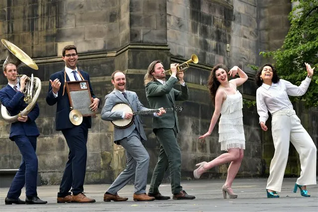 Performers from the Travelling Tent Show on the Royal Mile on July 13, 2023 ahead of the Edinburgh Jazz & Blues Festival which runs from 14-23 July 2023. (Photo by Alamy Live News)