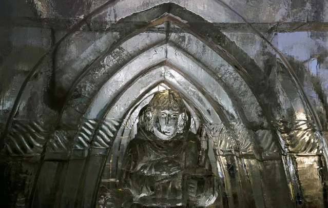 A statue inside the gothic-style ice dome is seen at the mountain resort of Hrebienok near the town of Stary Smokovec, Slovakia November 28, 2016. Picture taken November 28, 2016. (Photo by David W. Cerny/Reuters)