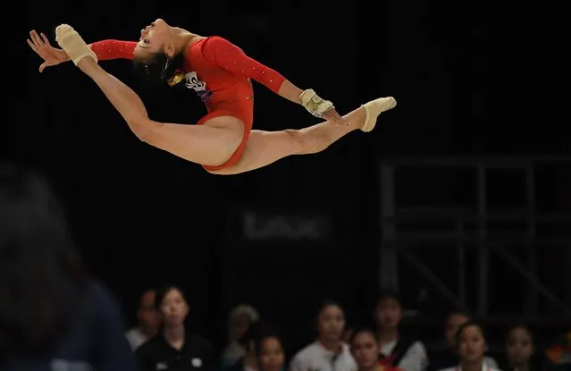 Japan's Shiho Nakaji competes in the floor exercise the women's team final of the artistic gymnastics event during the 2018 Asian Games in Jakarta on August 22, 2018. (Photo by Peter Parks/AFP Photo)