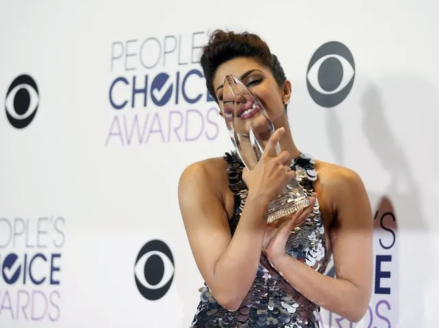 Actress Priyanka Chopra of "Quantico" poses backstage with her award for Favorite Actress in a New TV Series during the People's Choice Awards 2016 in Los Angeles, California January 6, 2016. (Photo by Danny Moloshok/Reuters)