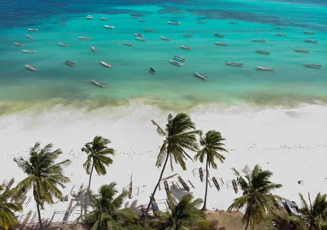 Drone photo shows small wooden fishing boats on the white sandy shore in the Indian Ocean in Zanzibar, Tanzania on August 23, 2018. (Photo by Mahmut Serdar Alakus/Anadolu Agency/Getty Images)