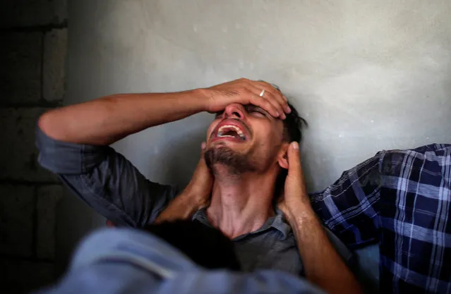 A relative of Palestinian Ahmed Omar, who was killed during a protest near the Israeli Erez crossing with Gaza, mourns during his funeral in Al-Shati refugee camp in Gaza City, September 19, 2018. (Photo by Mohammed Salem/Reuters)