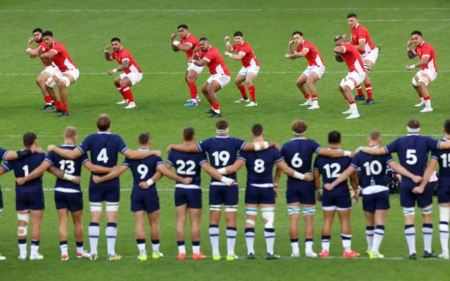 The players of Tonga perform The Sipi Tau ahead of kick-off prior to the Rugby World Cup France 2023 match between Scotland and Tonga at Stade de Nice on September 24, 2023 in Nice, France. (Photo by Peter Cziborra/Reuters)