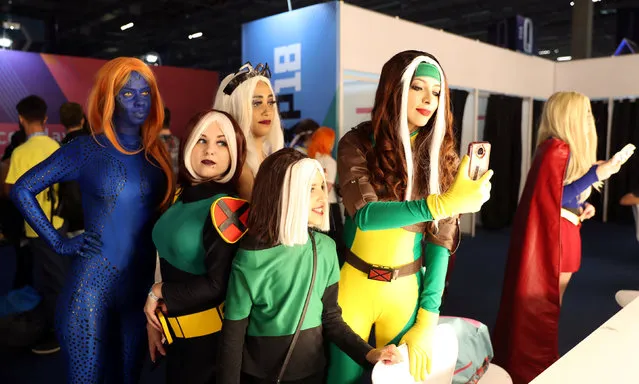 Cosplayers pose for a selfie photo backstage during the Sao Paulo Comic Con Experience in Sao Paulo, Brazil on December 6, 2018. (Photo by Paulo Whitaker/Reuters)