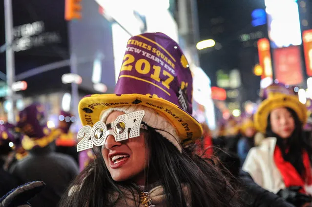 Revelers gather in Times Square on New Year's Eve in New York, U.S. December 31, 2016. (Photo by Stephanie Keith/Reuters)