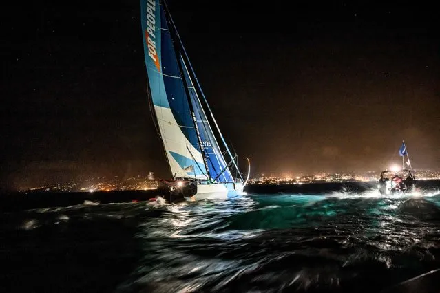 French skipper of the “For People” Thomas Ruyant and his co-skipper Morgan Lagraviere approach the finish line to win the Transat Jacques Vabre Imoca category sailing race, from Le Havre to the French overseas island of Martinique, in Fort-de-France, Martinique on November 19, 2023. (Photo by Loic Venance/AFP Photo)