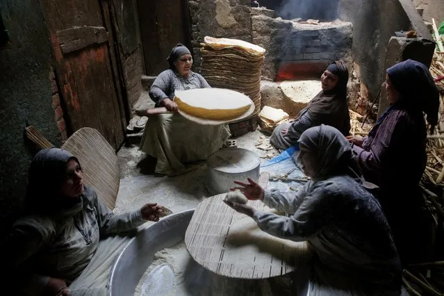 Nour El-Sabah, 35, prepares traditional food with her family to sell during the holy month of Ramadan in Beni Suef, Egypt, April 10, 2021. (Photo by Hayam Adel/Reuters)