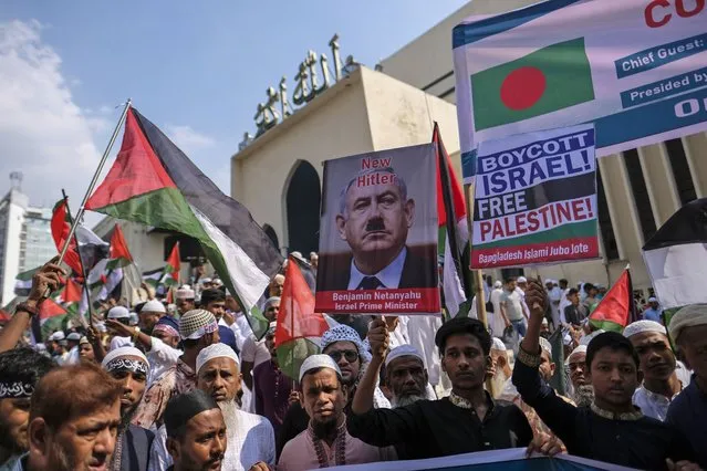 Muslims protest against Israel's military operations in Gaza and to support the Palestinian people, in front of Baitul Mukarram mosque in Dhaka, Bangladesh, Friday, October 13, 2023. (Photo by Mahmud Hossain Opu/AP Photo)