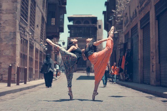In his series “Ballerinas of Cairo”, photographer Mohamed Taher documents Egyptian dancers making the city streets their stage – pirouetting, leaping and posing their way through their country’s sprawling capital. The photos are, at first glance, stunning snapshots of a city’s vibrant culture in motion. But considering the dangers Egyptian women face for roaming these same streets on a daily basis, their impact is far deeper. Sexual harassment continues to present not just a possibility but a terrifying reality in present-day Egypt. A 2013 United Nations report calculated that 99.3 percent of women in the country have experienced sexual harassment on the streets, a problem that’s sparked initiatives giving women a way to fight back. The violence is rooted in an extreme conservative perspective encouraging women to stay in the home. (Photo by Mohamed Taher/Ballerinas of Cairo)