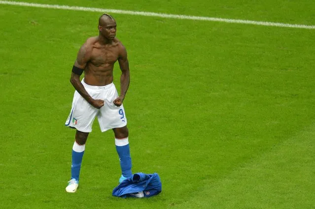 Italian forward Mario Balotelli celebrates after scoring the second goal during the Euro 2012 football championships semi-final match Germany vs Italy on June 28, 2012 at the National Stadium in Warsaw. (Photo by Gabriel Bouys/AFP Photo)