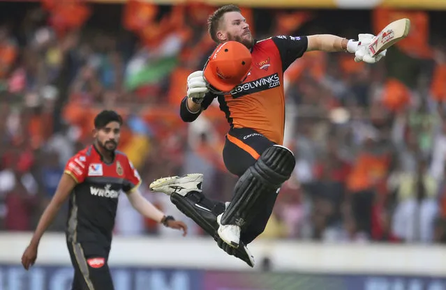 In this Sunday, March 31, 2019, file photo, Sunrisers Hyderabad's David Warner leaps in the air to celebrate scoring a century during the VIVO IPL T20 cricket match between Sunrisers Hyderabad and Royal Challengers Bangalore in Hyderabad, India. (Photo by Mahesh Kumar A./AP Photo/File)