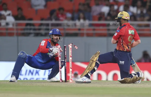 Delhi Capitals' wicketkeeper  Rishabh Pant, left, stumps out Punjab Kings' Jitesh Sharma during the Indian Premier League cricket tournament match between Delhi Capitals and Punjab Kings in Mullanpur, Punjab, India, Saturday, March 23, 2024. (Photo by Pankaj Nangia/AP Photo)