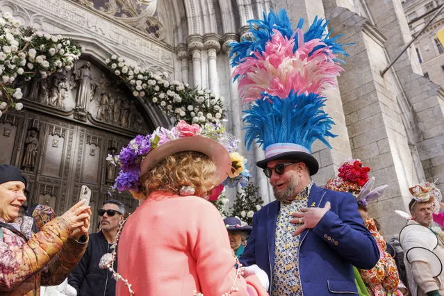 A person (C-R) wearing a hat in the transgender flag colors joins the annual Easter Parade and Bonnet Festival in front of St. Patrick's Cathedral on Fifth Avenue in New York, New York, USA, 31 March 2024. The International Transgender Day of Visibility is marked on 31 March annually, coinciding with Easter Sunday this year. (Photo by Sarah Yenesel/EPA)