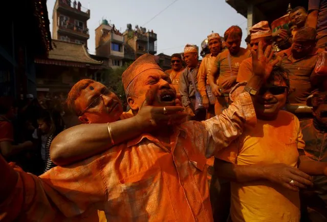 A devotee is smeared with vermillion powder while celebrating the “Sindoor Jatra” vermillion powder festival at Thimi, in Bhaktapur, Nepal, April 14, 2016. (Photo by Navesh Chitrakar/Reuters)