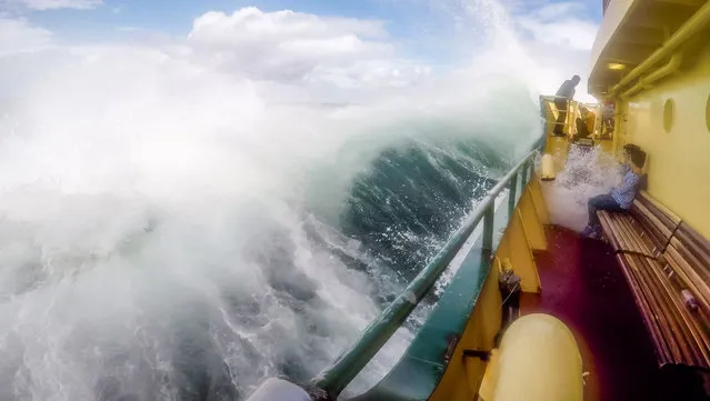 Wild weather drenches tourists, Sydney, Australia on March 7, 2017. A series of photographs as tourists take a soaking on Sydney's iconic Manly Ferry sailing big swells near Sydney's North Head. The Weather Bureau warns of large and powerful surf conditions expected to be hazardous for coastal activities such as rock fishing, swimming and surfing. (Photo by Hugh Peterswald/Pacific Press via ZUMA Wire/Rex Features/Shutterstock)