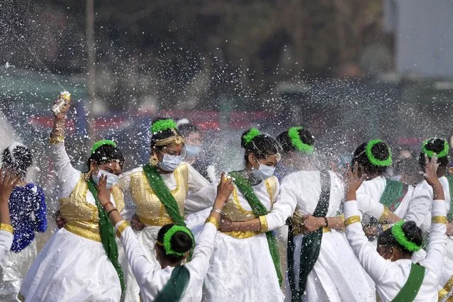 School children dance during India's Republic Day celebrations in Jammu, India, Wednesday, January 26, 2022. The day marks the anniversary of the adoption of the country’s constitution in 1950. (Photo by Channi Anand/AP Photo)