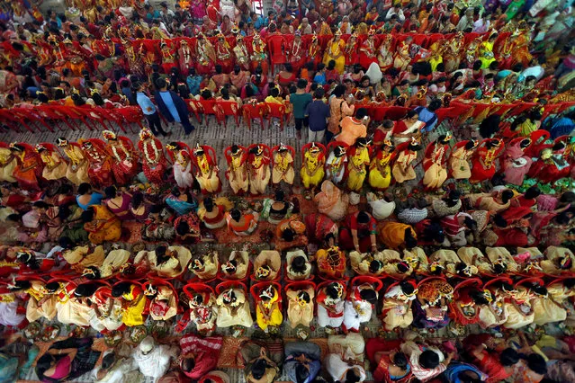 Hindu devotees worship young girls dressed as Kumari, during rituals to celebrate the Navratri Festival, inside the Adyapeath Temple, on the outskirts of Kolkata, April 5, 2017. (Photo by Rupak De Chowdhuri/Reuters)