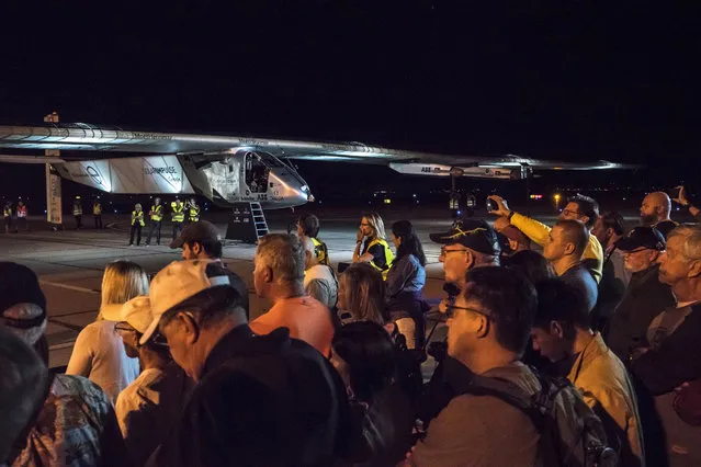 In this photo provided by Solar Impulse, people gather prior to the takeoff of a solar powered plane, “Solar Impulse 2”, in Goodyear, Ariz., Thursday, May 12, 2016. The solar-powered airplane that landed in Arizona last week is headed to Oklahoma on the latest leg of its around-the-world journey. (Photo by Jean Revillard/Solar Impulse via AP Photo)