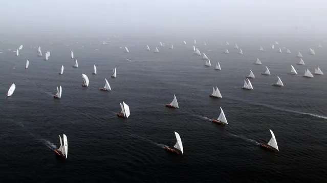 Emiratis sail during the Al-Gaffal traditional long-distance dhow sailing race between the island of Sir Bu Nair, near the Iranian coast, and the Gulf emirate of Dubai on May 27, 2012. (Photo by Karim Sahib/AFP Photo)