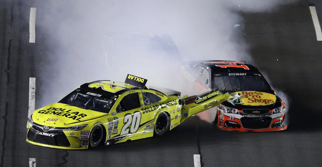 Matt Kenseth (20) is hit from behind by Tony Stewart during the NASCAR Sprint All-Star auto race at Charlotte Motor Speedway in Concord, N.C., Saturday, May 21, 2016. (Photo by Gerry Broome/AP Photo)