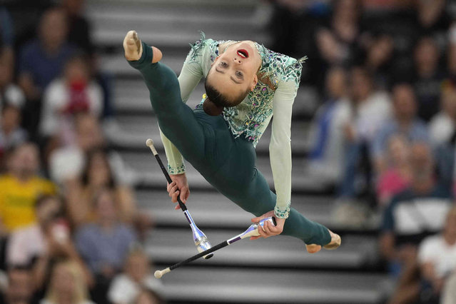 Onofriichuk Taisiia, of Ukraine, performs clubs exercise in the rhythmic gymnastics individuals all-round final at La Chapelle Arena at the 2024 Summer Olympics, Friday, August 9, 2024, in Paris, France. (Photo by Charlie Riedel/AP Photo)