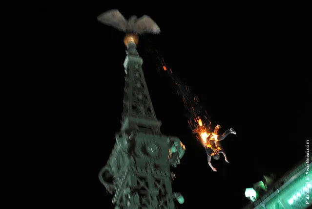 In this photo provided by World Press Photo, the 1st Prize Spot News Singles category of the 2011 World Press Photo contest by Peter Lakatos, Hungary, MTI, shows a suicide jump, Budapest, Hungary, 22 May 2010