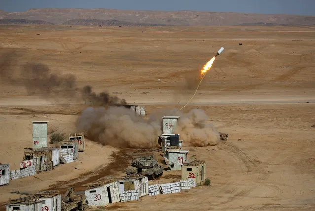 A mine-clearing line charge is fired during an Israeli miltary combined forces drill in Shizafon base, near Eilat in southern Israel June 7, 2016. (Photo by Amir Cohen/Reuters)