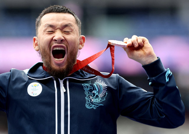 Bronze medalist, Dastan Mukashbekov of Team Kazakhstan, poses for a photo during the medal ceremony for the Men's Shot Put F36 Final on day eight of the Paris 2024 Summer Paralympic Games at Stade de France on September 05, 2024 in Paris, France. (Photo by Umit Bektas/Reuters)