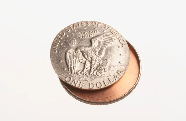 This coin may appear to be an Eisenhower silver dollar, but it is really a concealment device. It was used to hide messages or film so they could be sent secretly. Because it looks like ordinary pocket change, it is almost undetectable. (Photo by Central Intelligence Agency)