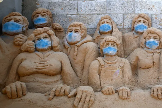 A sand sculpture by Palestinian artist Rana al-Ramlawi is pictured in her yard in Gaza City, during the novel coronavirus pandemic crisis, on April 3, 2020. (Photo by Mohammed Abed/AFP Photo)