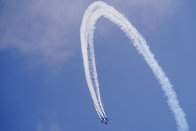The U.S. Navy Blue Angels perform during the Chicago Air and Water show over Lake Michigan, Sunday, August 21, 2022, in Chicago. (Photo by Kiichiro Sato/AP Photo)