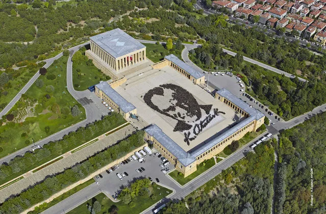 In this aerial photo made available by the Turkish Military, some 6,000 people form a large portrait of Mustafa Kemal Ataturk, the founder of modern Turkey at his mausoleum in Ankara, Turkey, Tuesday, August 26, 2014. August 26, 1922 was the final phase of Turkey's War of Independence led by Ataturk himself. (Photo by AP Photo/Turkish Military)