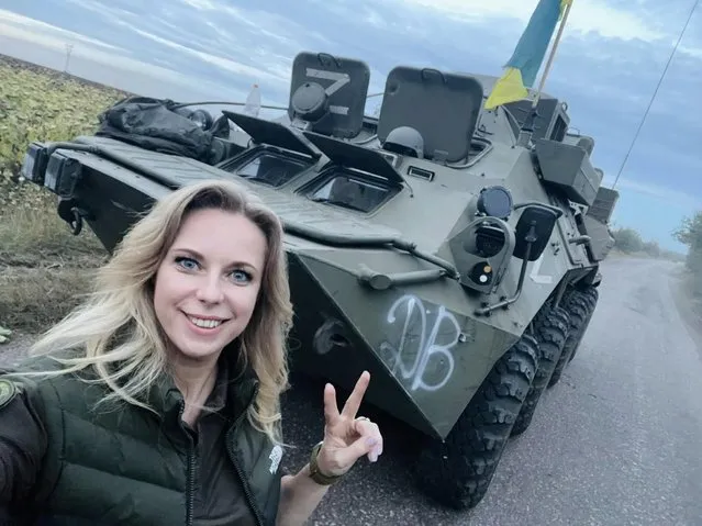 Ukrainian politician Yulia Yatsyk poses with a captured Russian vehicle in the Kharkiv region in a photo posted to her Facebook page on September 11, 2022. (Photo by Yulia Yatsyk/Facebook)