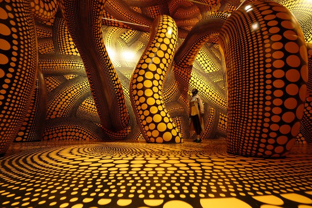 Visitors view the Yayoi Kusama exhibition at National Gallery of Victoria on December 13, 2024 in Melbourne, Australia. (Photo by Graham Denholm/Getty Images for NGV)